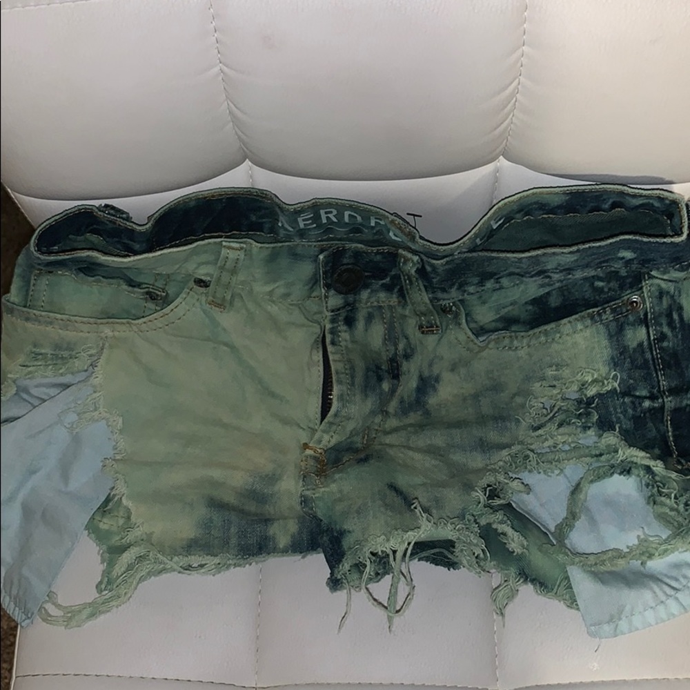 Green distressed shorts